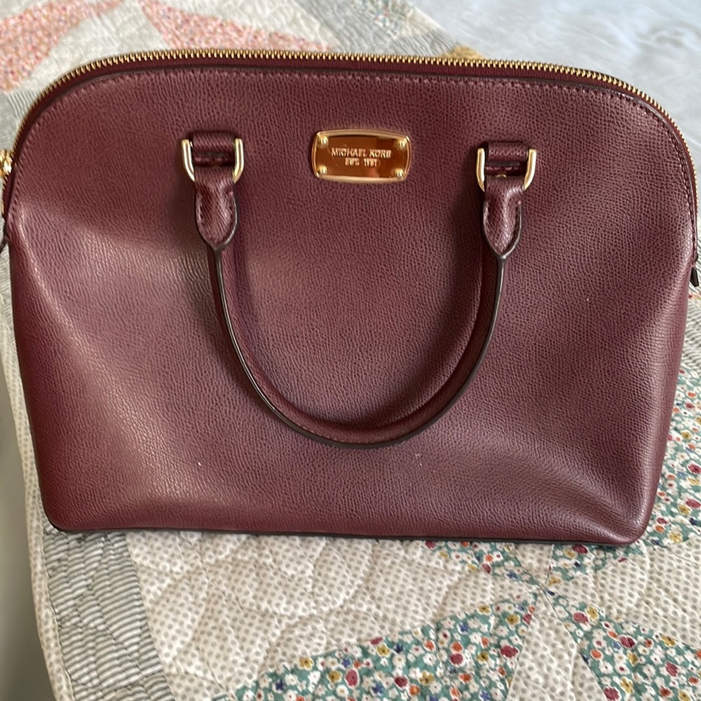 Michael Kors handbag with handles.
